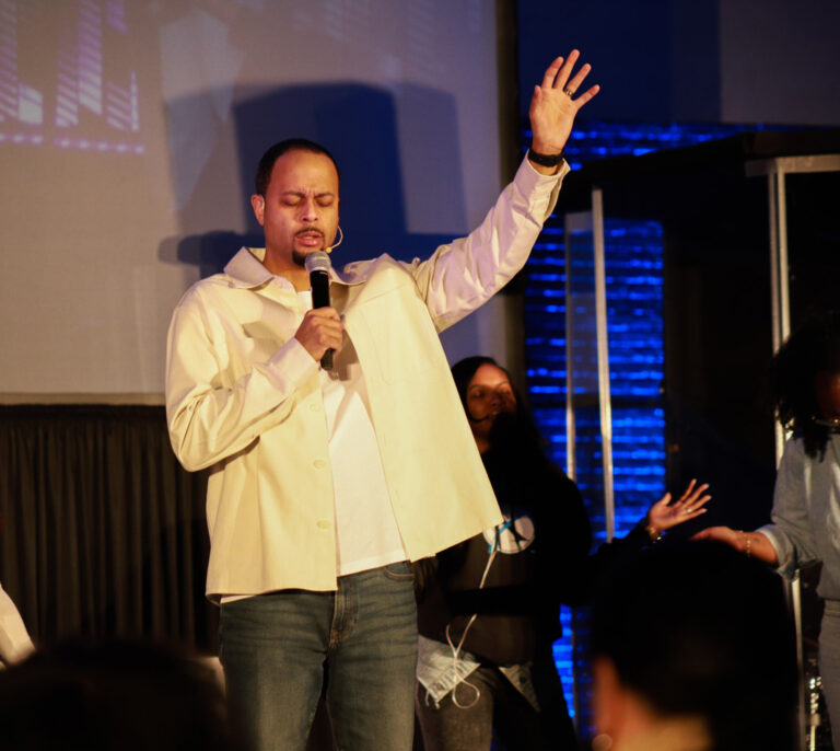 Pastor André praying